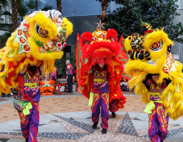 A lion dance team performs at Sheung Wan to celebrate the Chinese New Year in Hong Kong