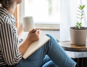 Woman starts to write a family memory journal