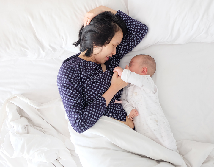 The Family Zone featuring mother and child in bed